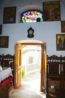 Glas in lood boven de deur van Olympos